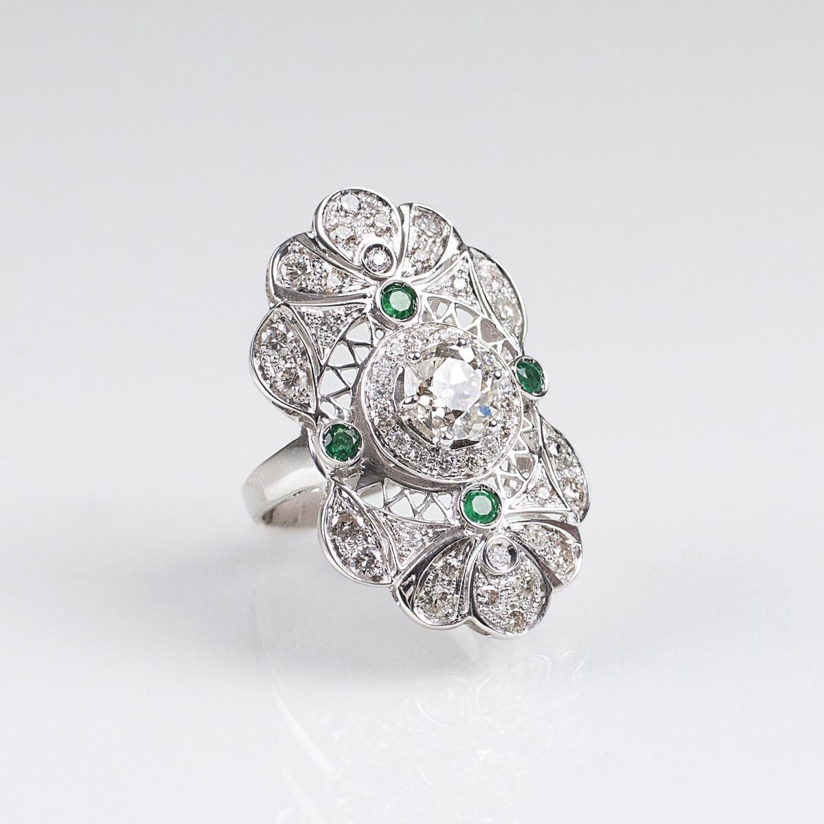 A large Emerald Diamond Ring with Old European Cut Solitaire Diamond