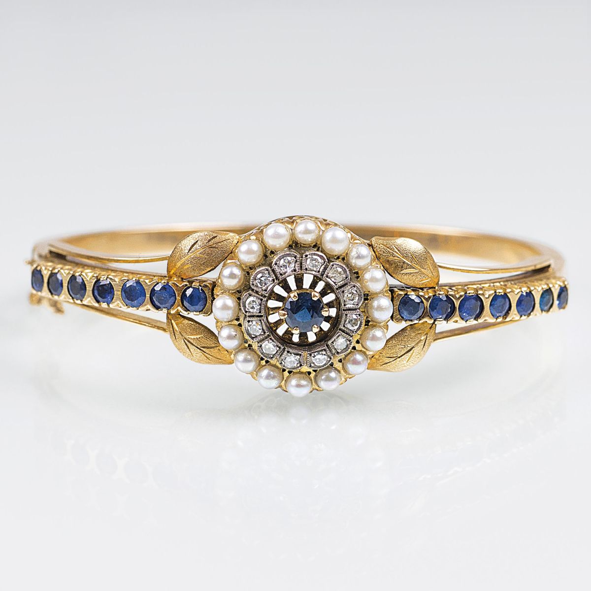 An Antique Gold Bangle Bracelet with Sapphires and Pearls