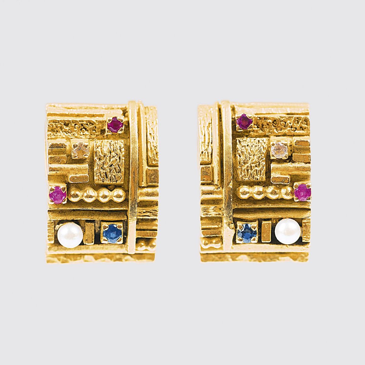 A Pair of Gold Earclips with Gemstones
