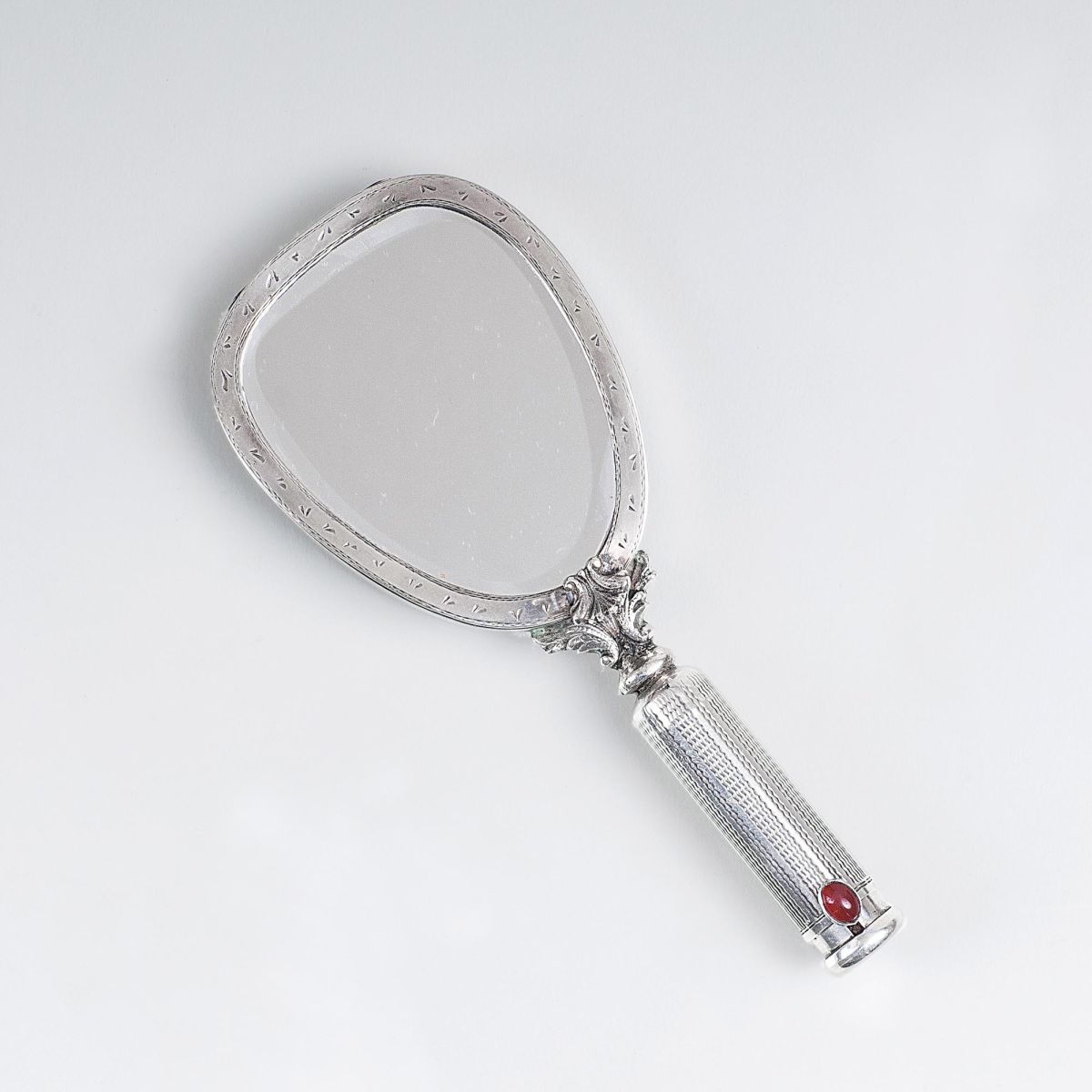 A Hand Mirror with small Compartments