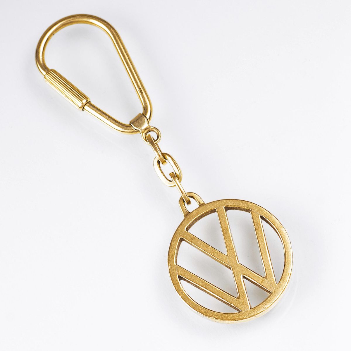 A Gold Key Ring with Volkswagen Emblem 'VW'