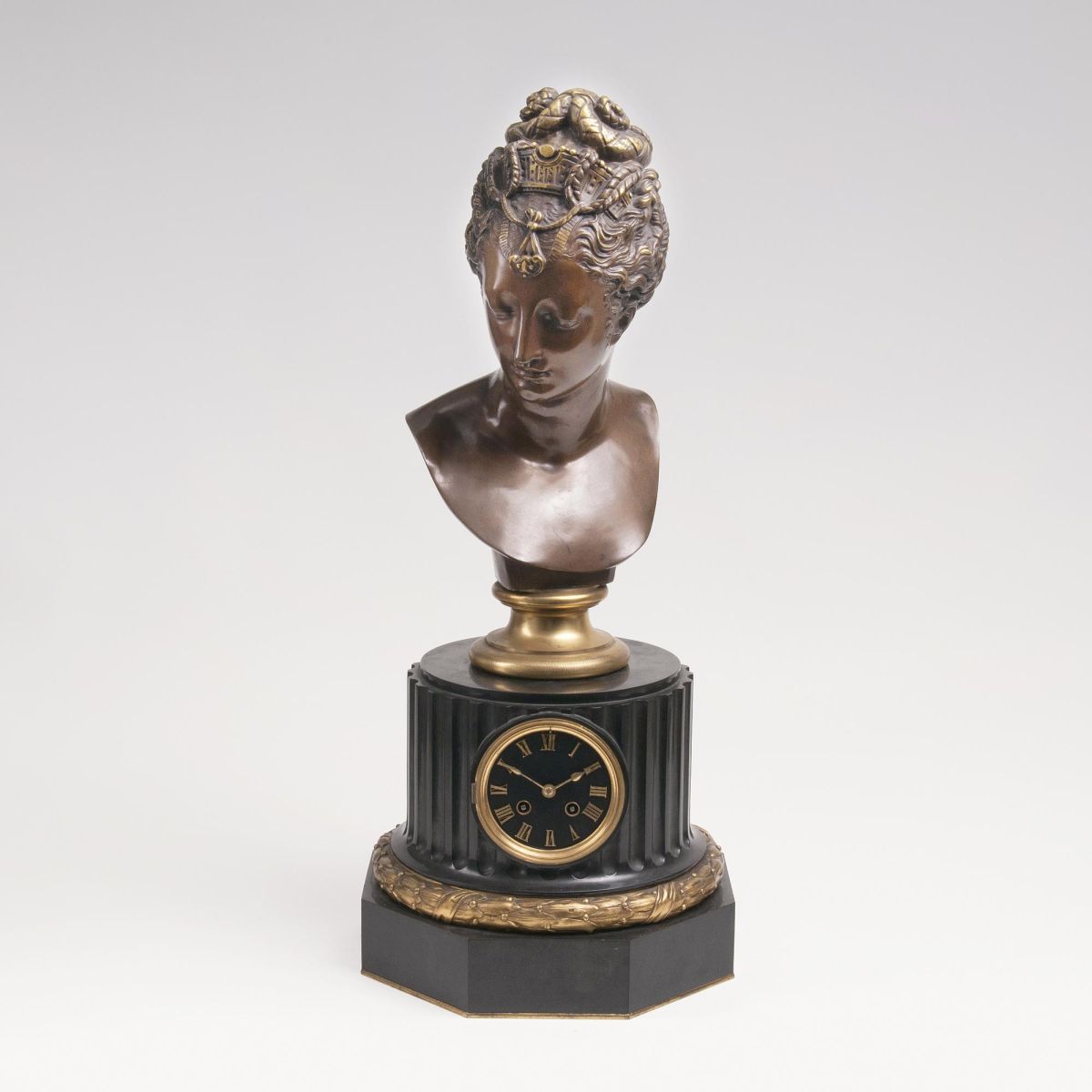 A Figural Mantle Clock 'Pauline Bonaparte' on wooden column