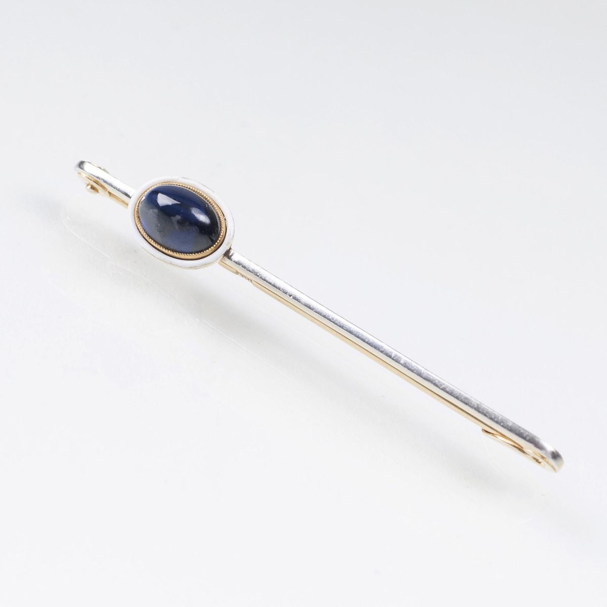 A Russian Tie Pin With Sapphire Cabochon