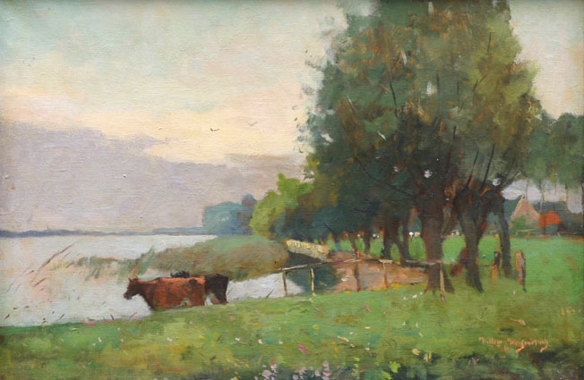 A midsummer landscape with cows at a lake