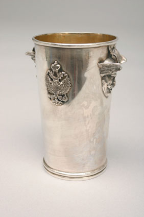 A russian beaker with double eagle ornament and russian portraits