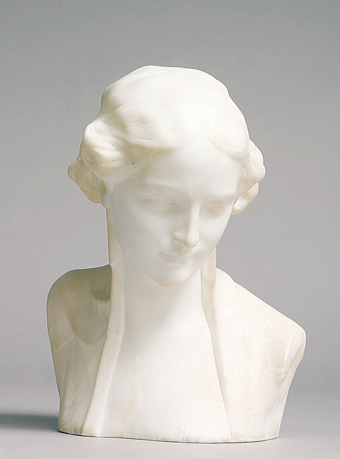 An Art-Nouveau marble bust 'Smiling young woman'