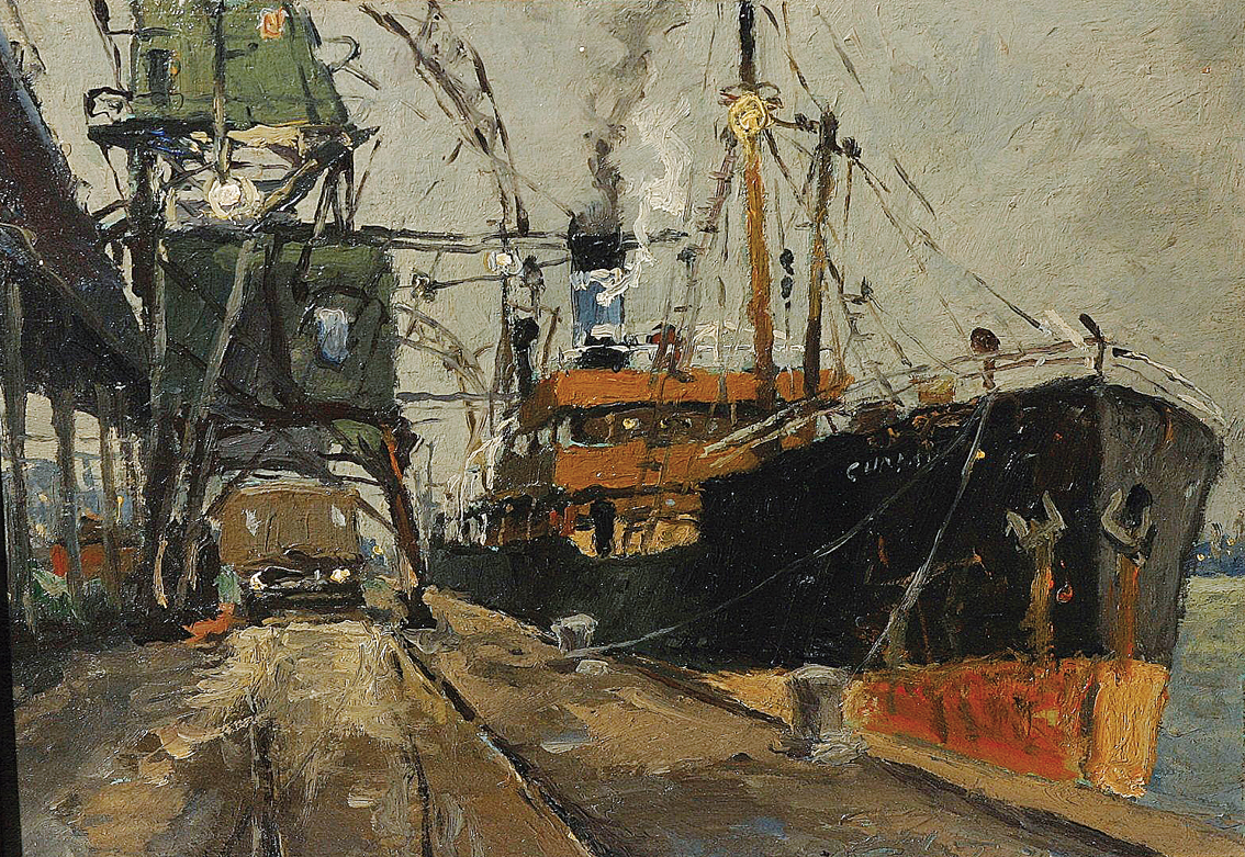 A cargo steamer and cranes in a harbour