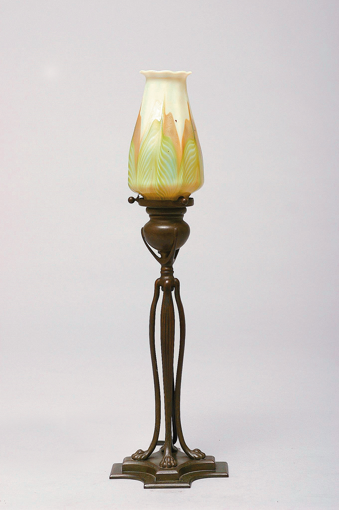 An original table lamp with feet of lions