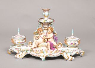 A rare writing set with a pair of putti