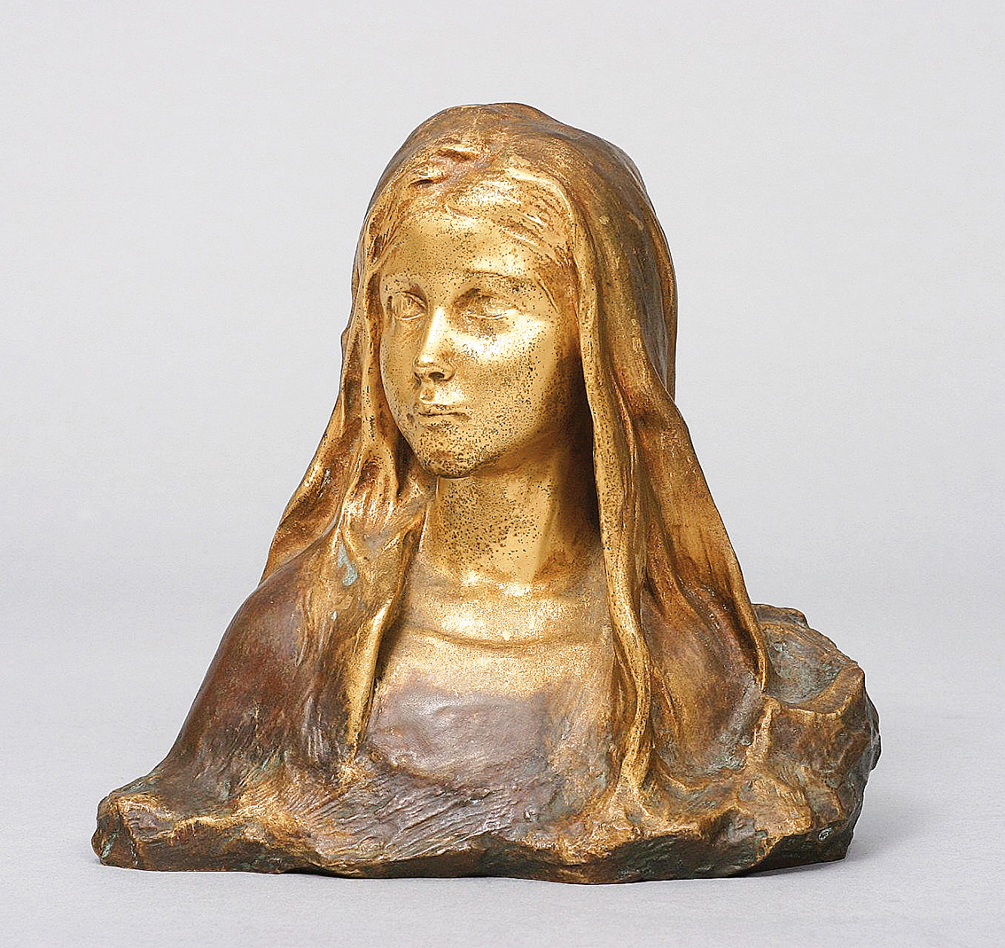 A bronze bust of a girl