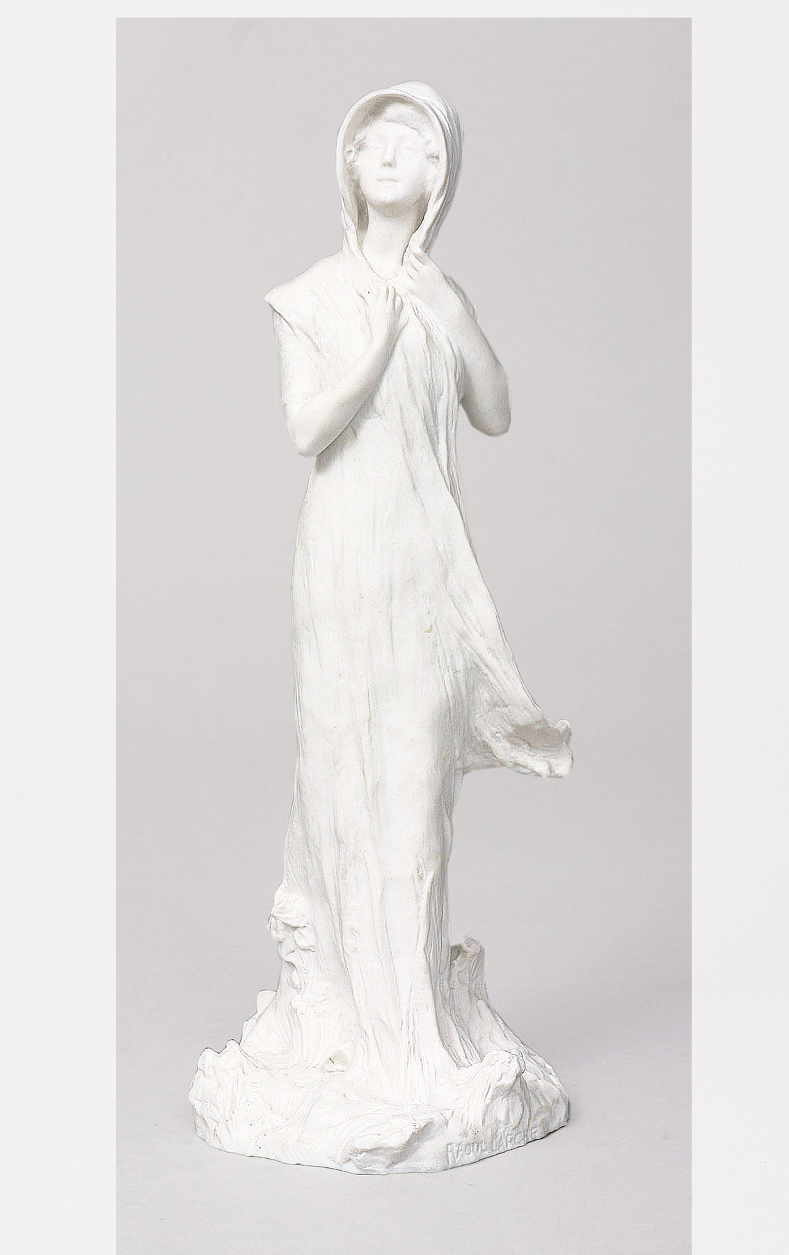 An art nouveau figure of a young lady in biscuit porcelain