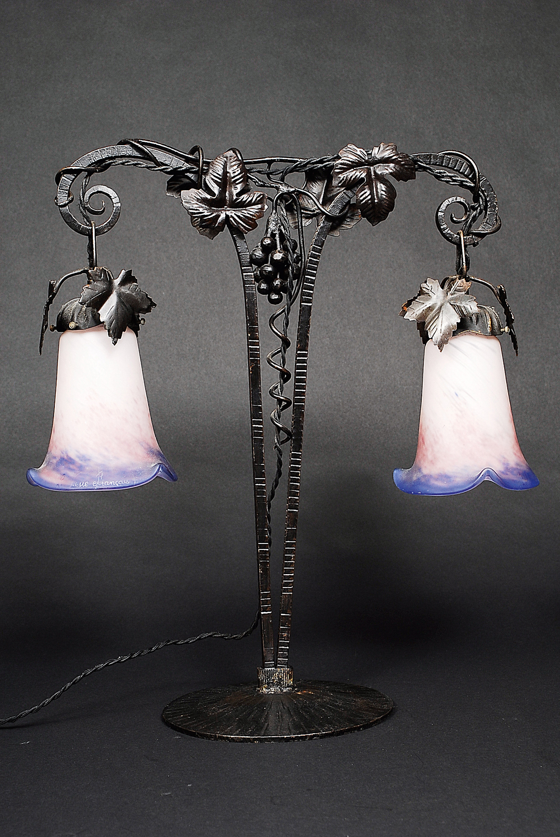 An art nouveau lamp with grapes