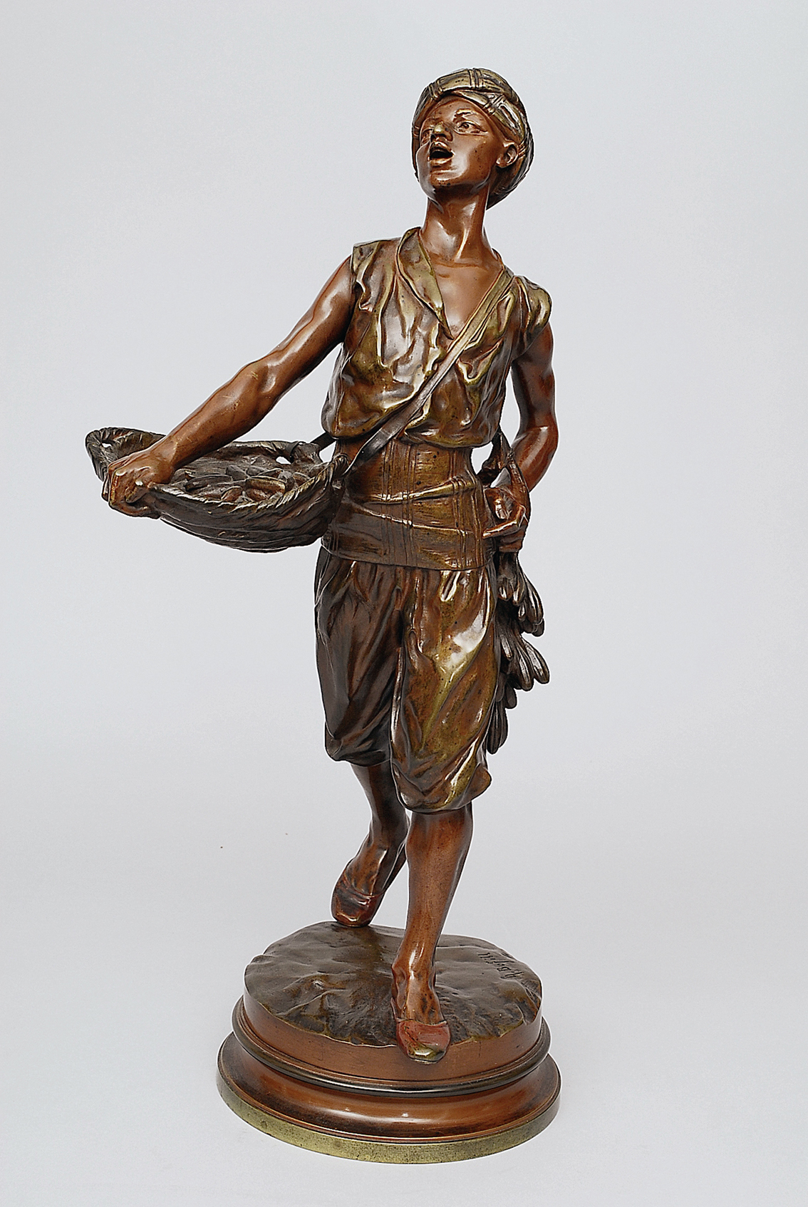 An expressive bronze figure 'The Arabic date seller'