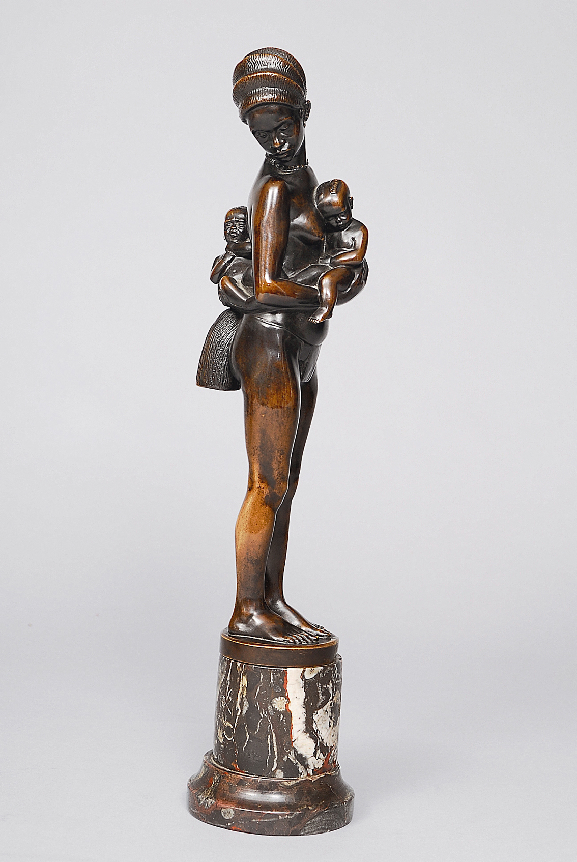 A bronze figure 'The African woman with two children'