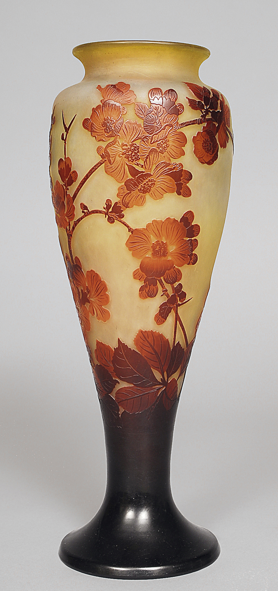 A large Art Nouveau vase with dog roses