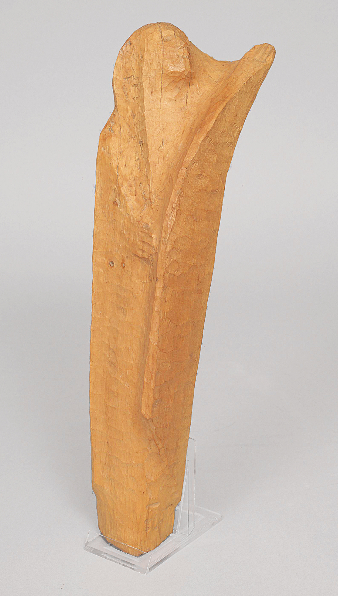 A wood sculpture of a woman