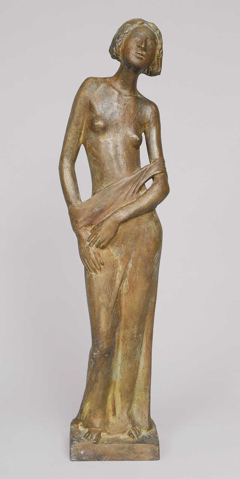 A bronze-figure 'Girl, letting drop the gown'