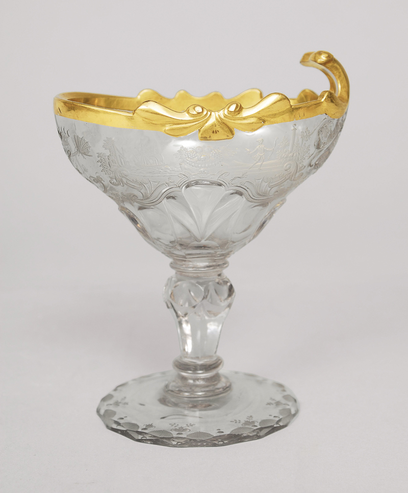 A baroque glass bowl with cut ornaments