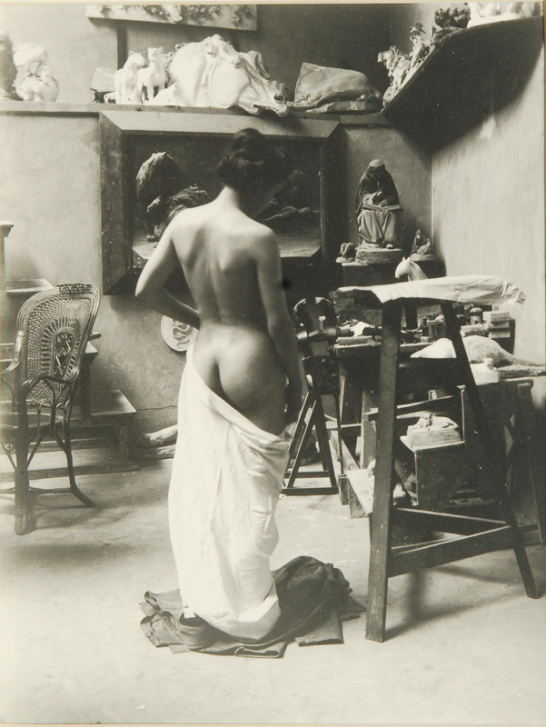 Female nude in a painter's studio