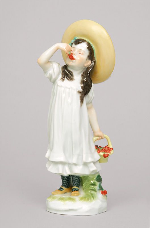 A figurine 'girl with hat and cherry basket'