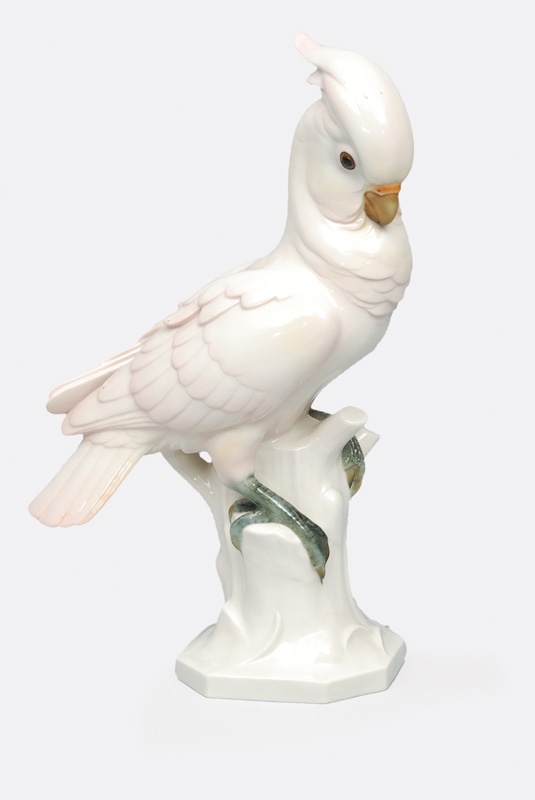 An animal figurine 'ink parrot deated on a brunch base'