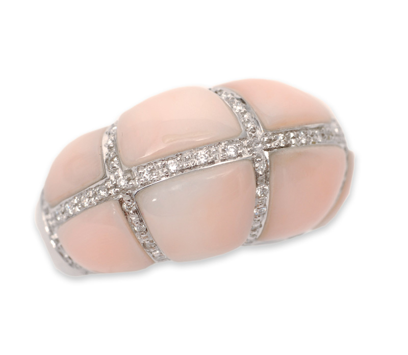 A coral diamond ring
