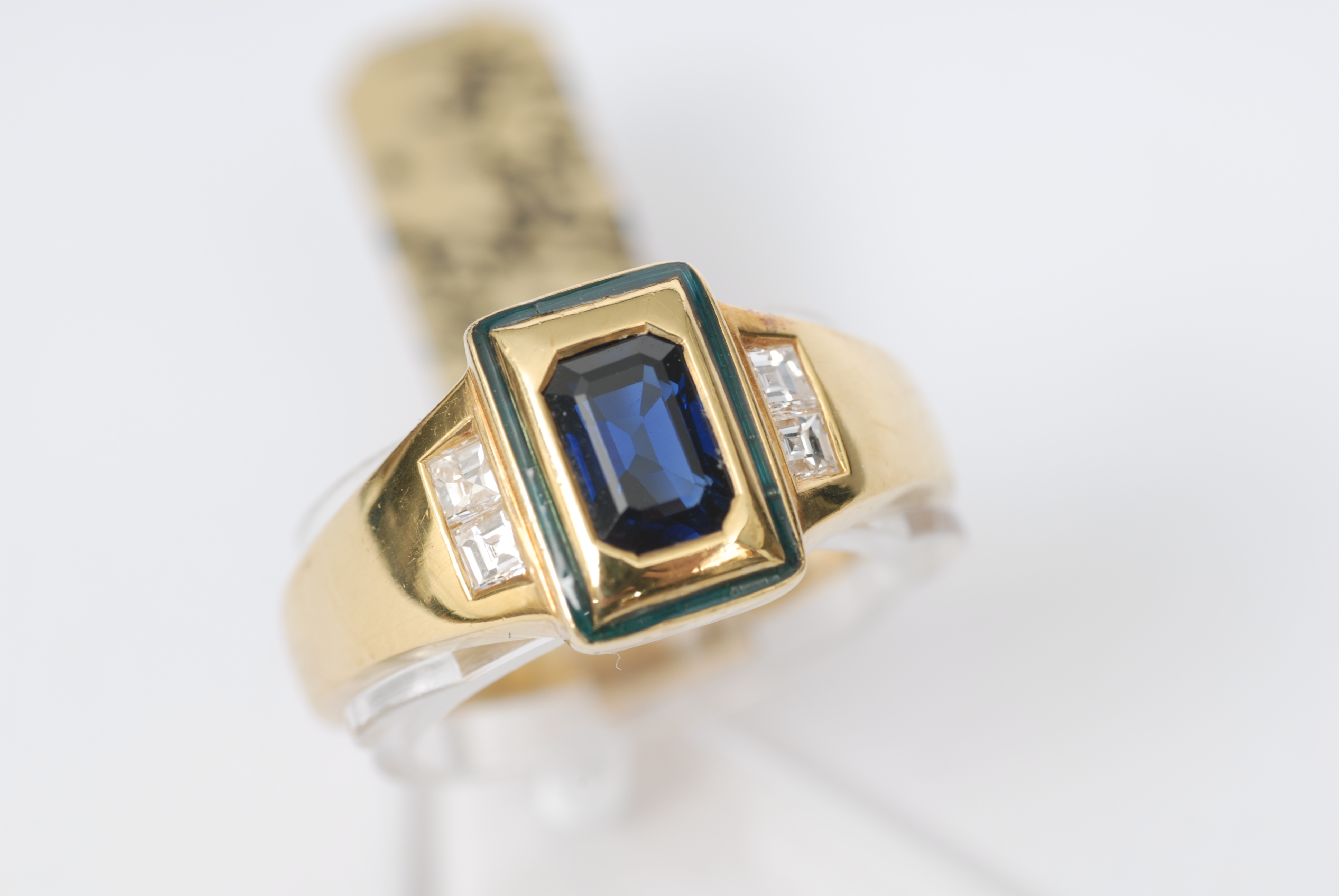 A petite sapphire diamond ring