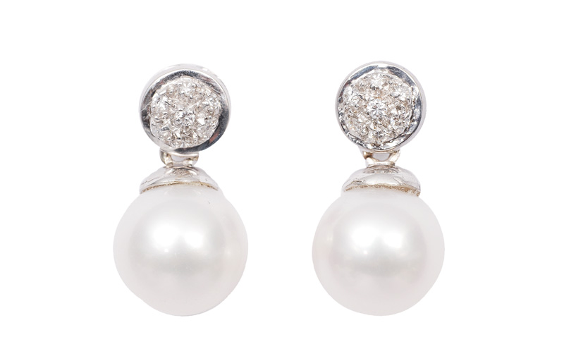 A pair of petite pearl diamond ear studs