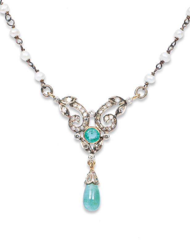 A petite emerald diamond necklace