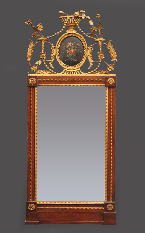 A Louis-Seize mirror with ornaments of flowers and festons