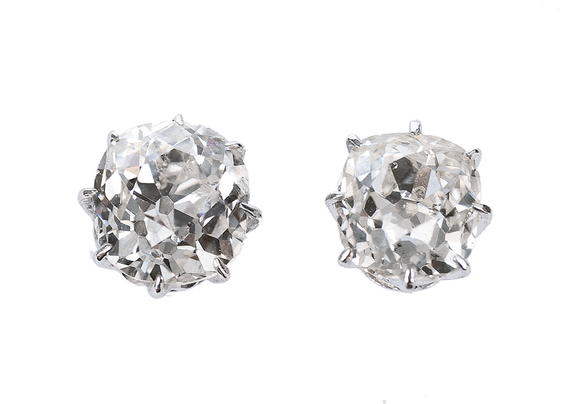 A pair of single stone diamond ear studs