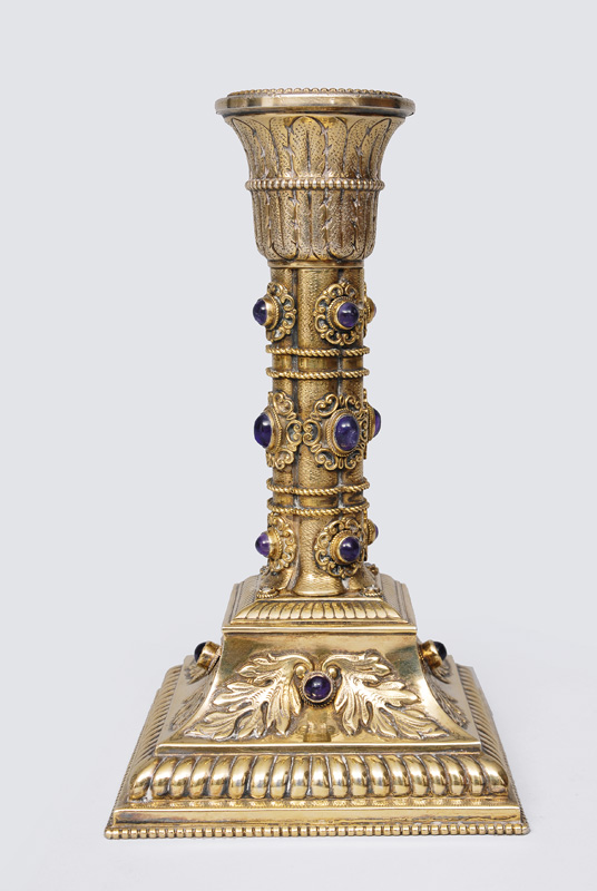 A gilded candlestick with amethysts
