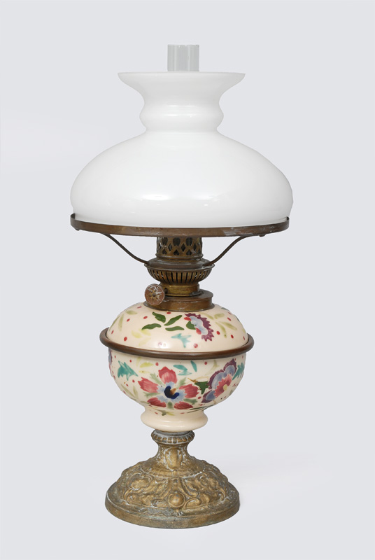 A petrol lamp with floral painted petrol tank