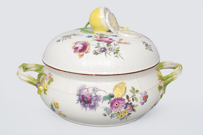 A big tureen with floral decoration and applied lemon knob