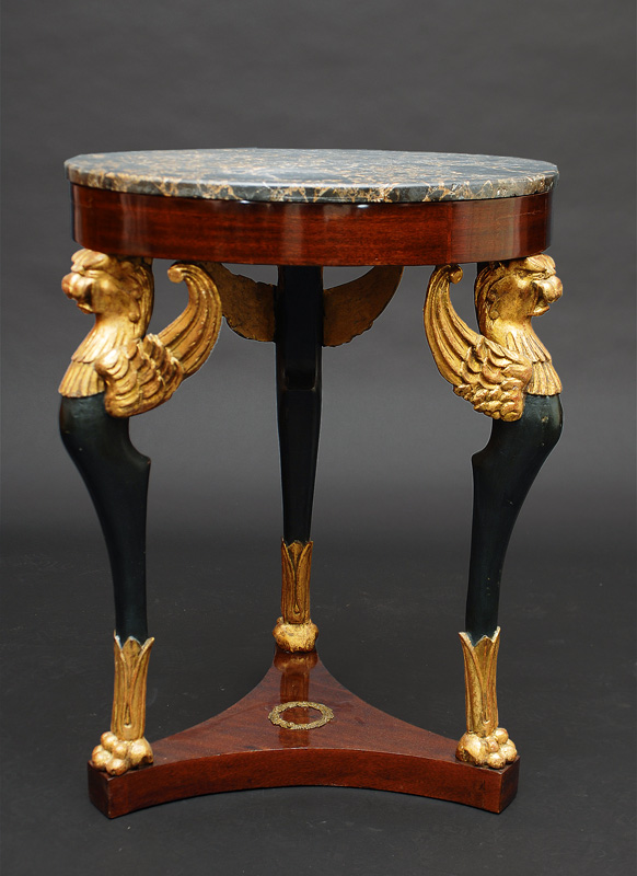 An Empire table with eagle ornaments