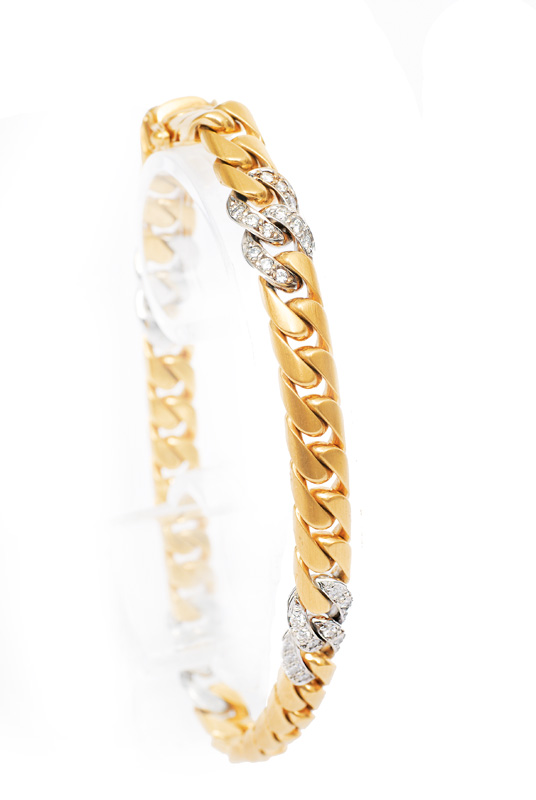 A gold bracelet with diamonds