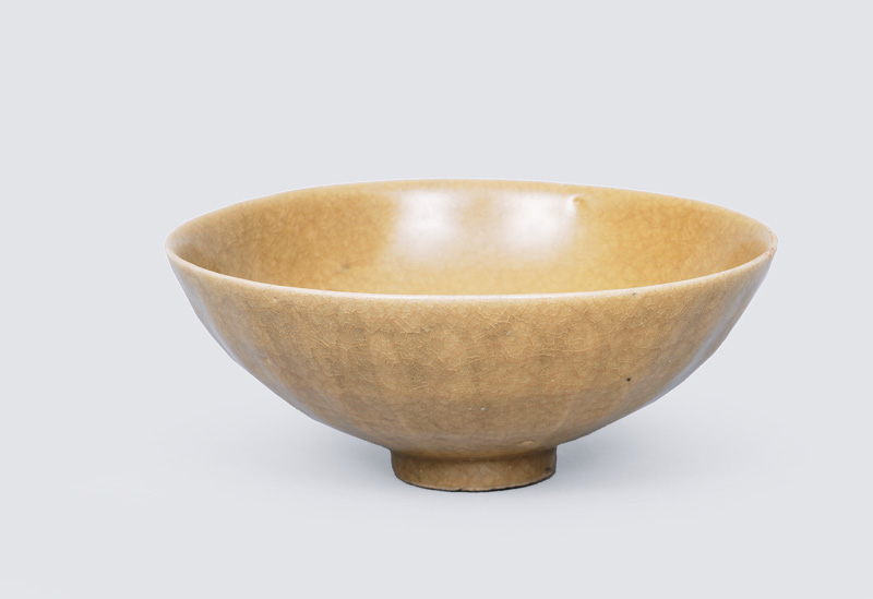 A celadon bowl with lotus relief