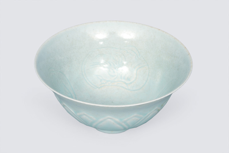 A rare celadon bowl with lotus relief