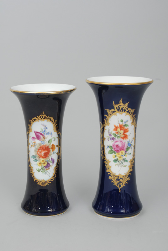 Two bar-shaped vases with cobalt blue ground, gilded cartouches and bouquets