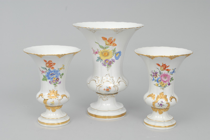 A set of 3 crater-shaped vases with flower painting and gilded rocaille relief