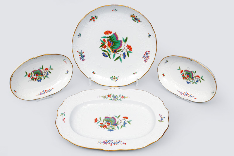A convolute of 4 different platters with Marseille relief and butterfly pattern A convolute of 4 different platters with Marseille relief and butterfly pattern