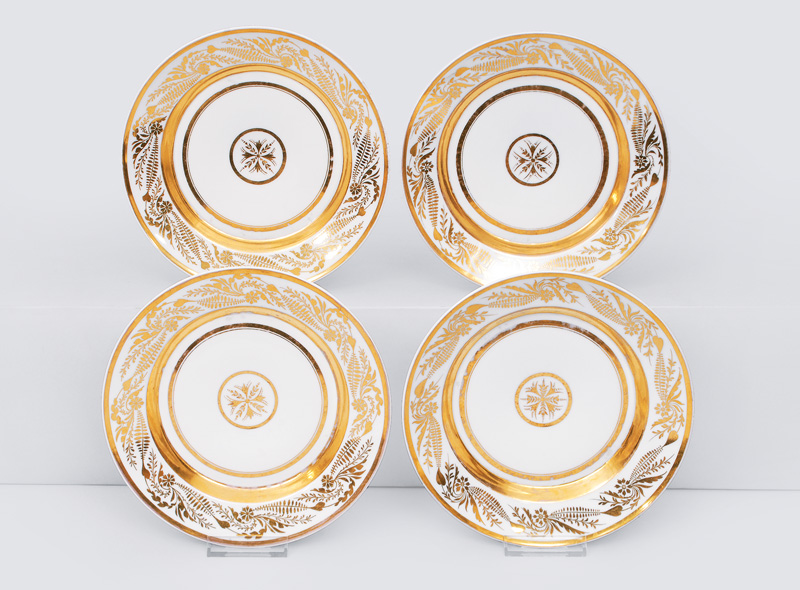 A set of 4 Empire plates with rich gold decor