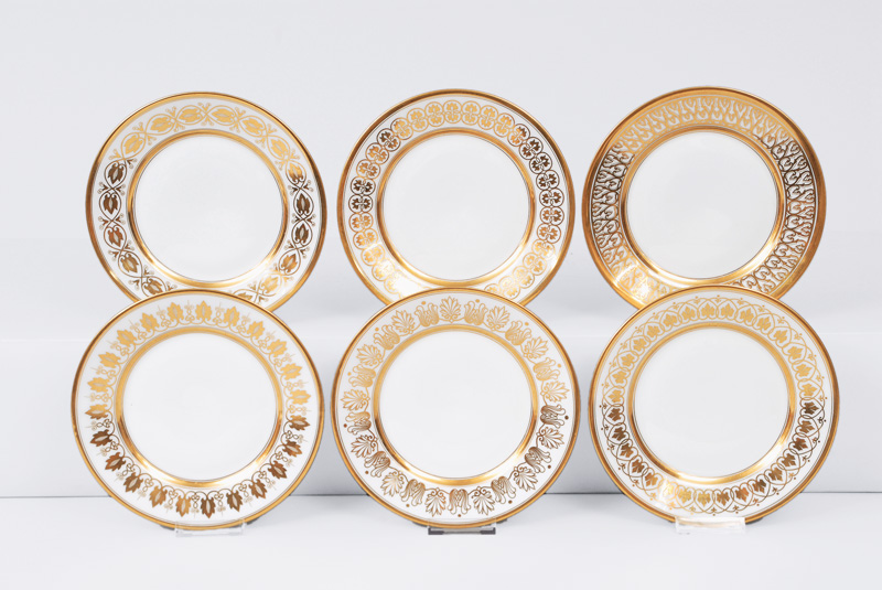 A set of 6 plates with different gold decor