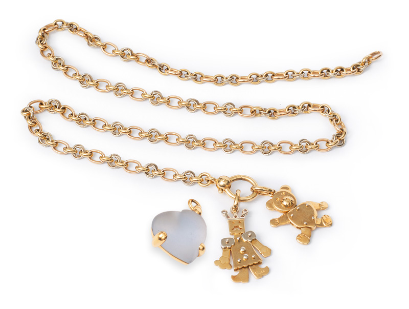 A high quality gold necklace with three pendants by Pomellato