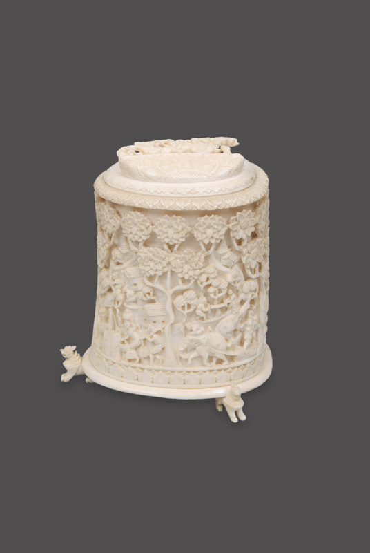A box on three lion feet with richly carved decoration A box on three lion feet with richly carved decoration