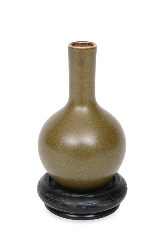 A small vase with moss-green glaze