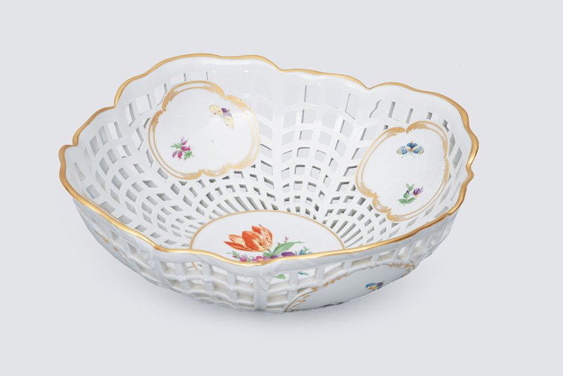 A big openworked basket with flower painting and gilded rim
