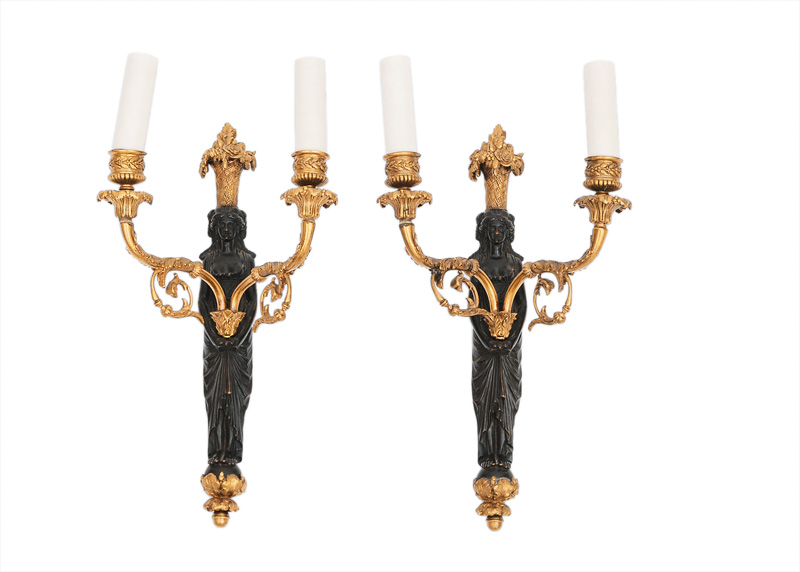 A pair sconces with antique-like caryatide
