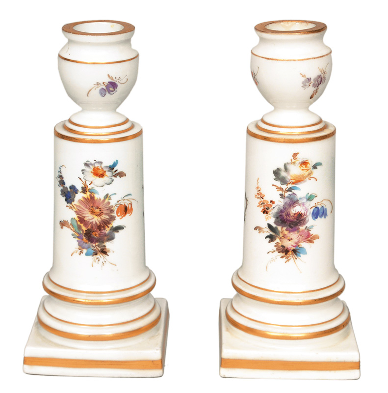 A pair of candlesticks with grisaille flowers