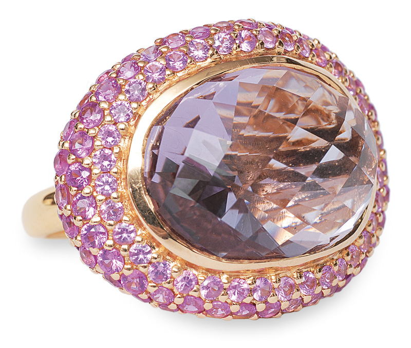 A large pink amethyst ring with sapphires